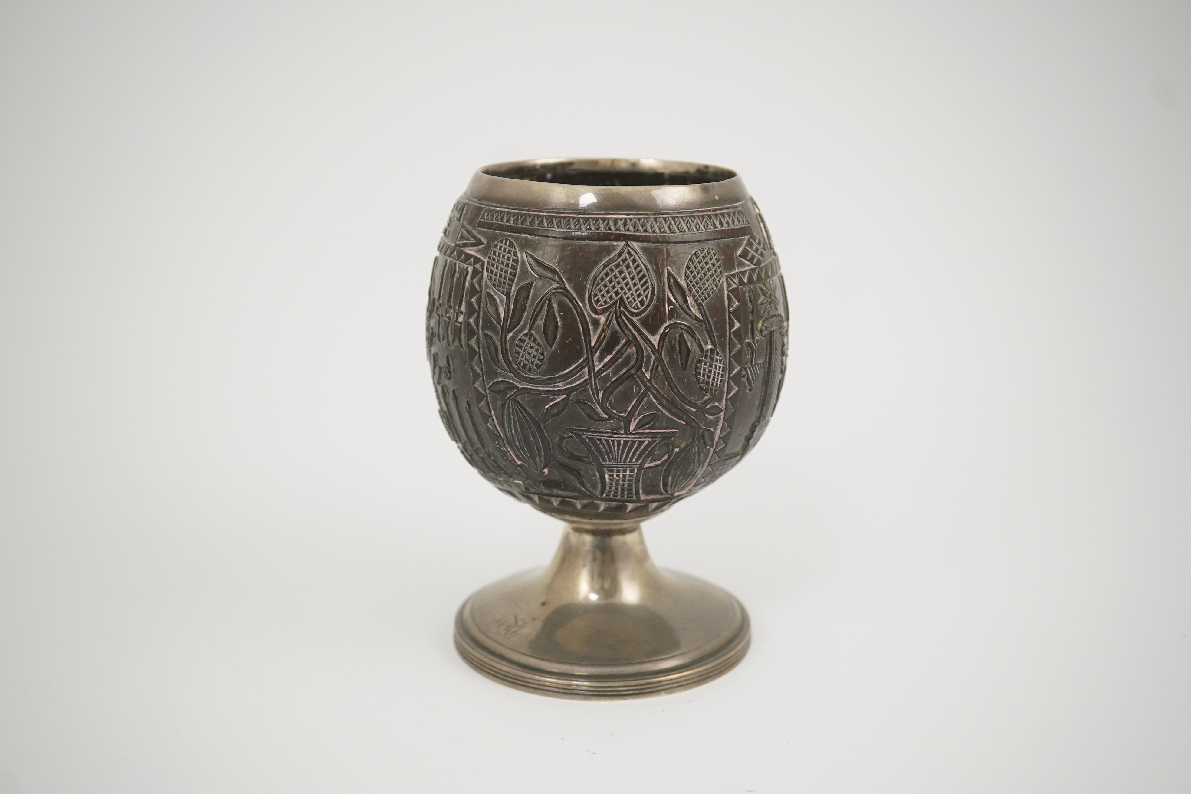 A George III silver mounted 'Masonic' coconut cup, maker GW